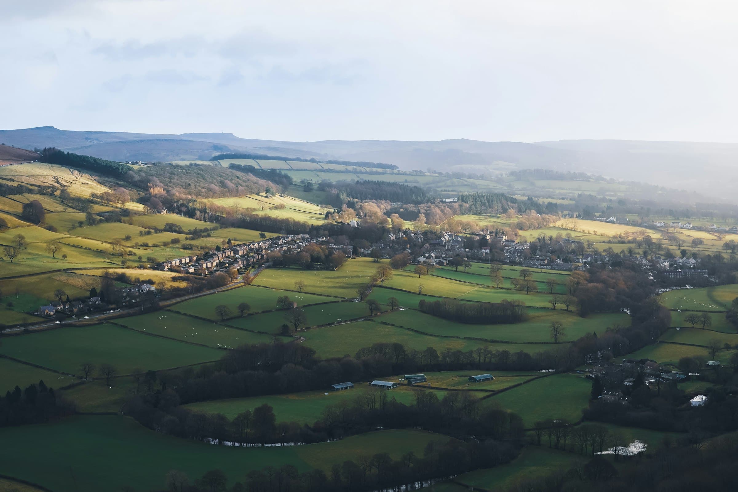 Aerial view of an English village set among rolling countryside